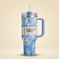 Cloud tie-dye 40oz insulated tumbler in Blue colorway with handle and straw
